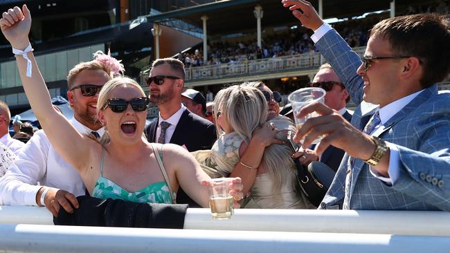 Racegoers celebrate after Tyler Schiller riding Front Page wins Race 5 The Kosciuszko. (Photo by Jeremy Ng/Getty Images)