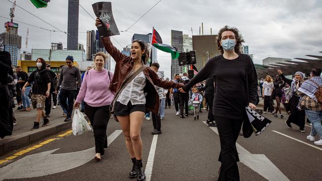 Young women chant and wave flags during a pro-Palestinian rally in Melbourne last month. Picture: NewsWire/Tamati Smith.