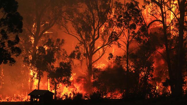 Fire rages in the Gippsland town of Bruthen, Victoria, last month. Picture: Aaron Francis