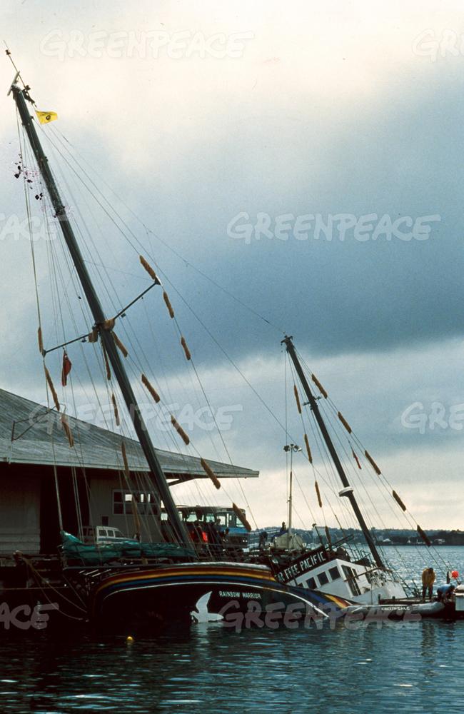 Wounded warrior ... The Rainbow Warrior lies striken after the explosive blast which ripped open her hull. Source: Greenpeace