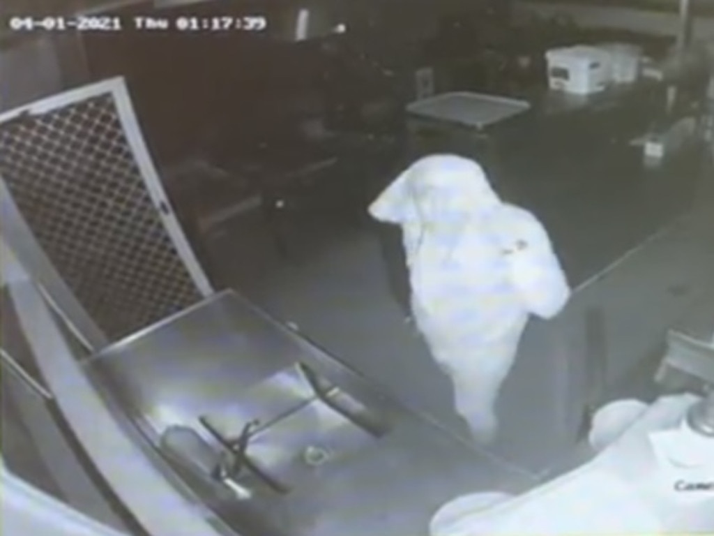 A thief tries to conceal his identity with a head covering.