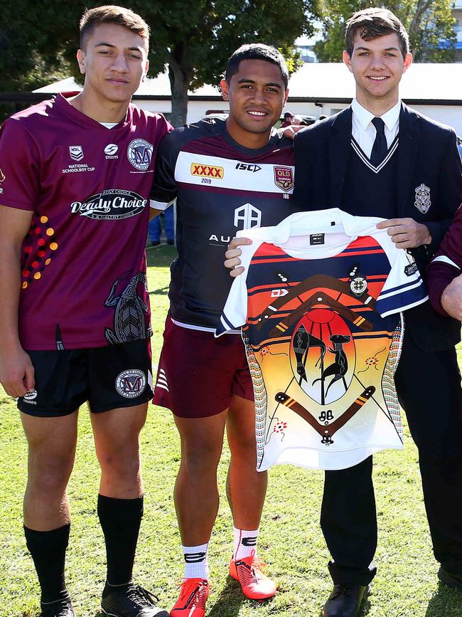 Konrad Tu'ua of Marsden SHS with \Anthony Milford and St Mary’s Karne Young who designed the jersey. Pics Adam Head