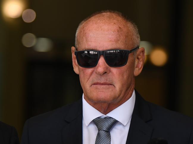 Chris Dawson leaves the Downing Centre Local Court in Sydney, Tuesday, February 11, 2020. Dawson, who was extradited from Queensland, is appearing in Downing Centre Local Court after being charged in December with murdering his wife, Lynette Dawson, who disappeared in 1982. (AAP Image/Joel Carrett) NO ARCHIVING