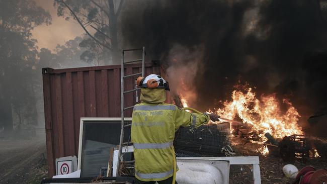 Firefighters carry out property protection on remote properties on the NSW south coast. Picture Gary Ramage