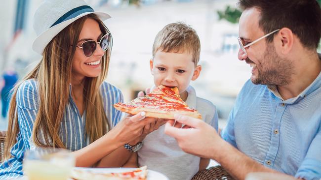 happy family spending time in pizzeria