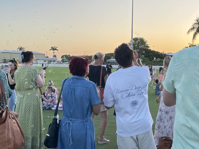 The crowd blew bubbles into the sky at sunset while a live band played Somewhere Over the Rainbow. Picture: Janessa Ekert