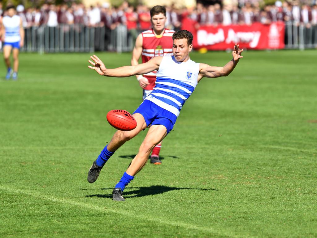 St Peter’s player Will Warrick gets a kick away against Prince Alfred. Picture: AAP/ Keryn Stevens.