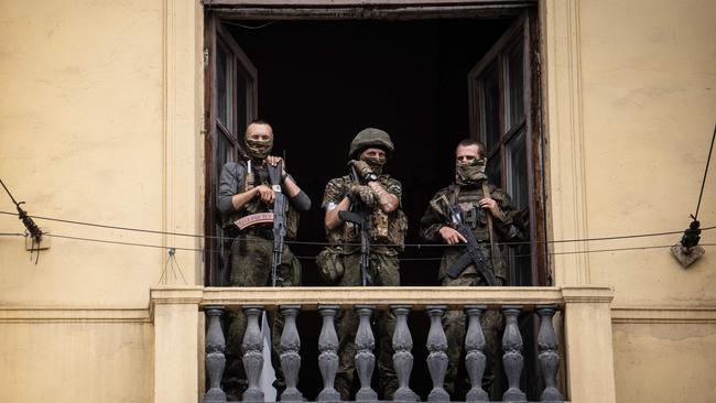 Members of Wagner group stand on the balcony of the circus building in the city of Rostov-on-Don. Picture: AFP