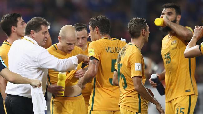 Socceroos coach Ange Postecoglou speaks to his players.