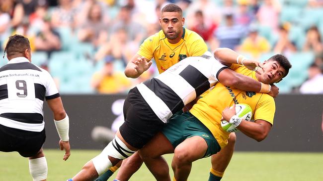 Wycliff Palu of the Barbarians tackles Jordan Uelese of the Wallabies. Picture: Mark Kolbe/Getty Images