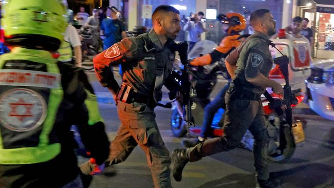 Security forces rush to the scene of a shooting attack in Tel Aviv. Picture: AFP