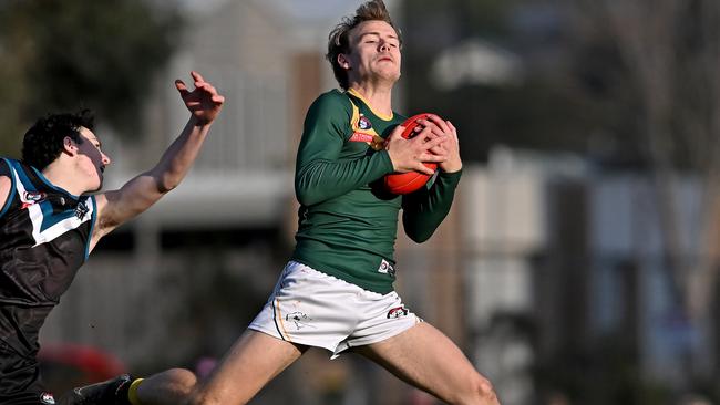 Bradley Johnstone marks for Old Eltham Collegians. Picture: Andy Brownbill