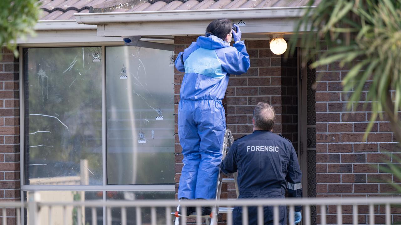 Police detectives and forensics investigate the house shooting. Picture: NewsWire / Tony Gough