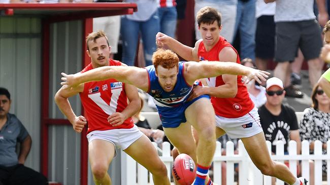 Central District's Murray Stephenson about to take off with the ball against North Adelaide. Picture: Tom Huntley