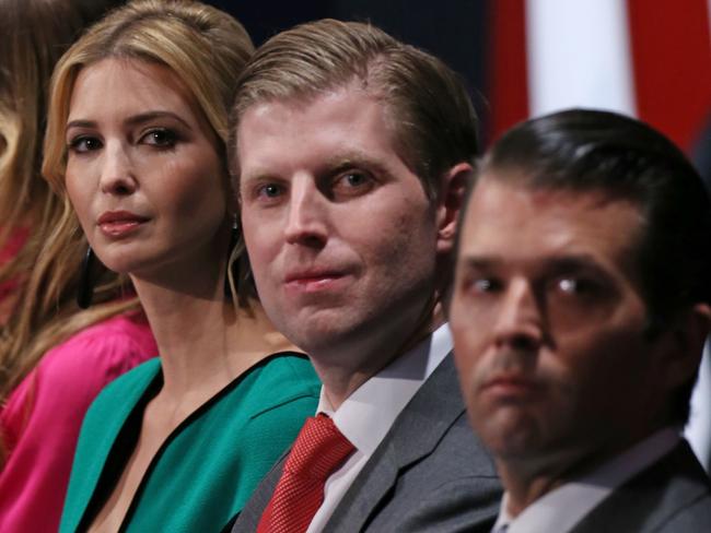 (FILES) This October 9, 2016 file photo shows family members of Republican Presidential-elect Donald Trump, (from L-R) wife Melania Trump, daughter Ivanka Trump, and sons Eric Trump and Donald Trump Jr.as they listen to the second presidential debate at Washington University in St. Louis, Missouri. Donald Trump shook up his White House transition team Friday by appointing running mate Mike Pence as its chairman and naming a cohort of Washington insiders -- along with three of his children -- to the operation. Three of Trump's grown children -- Don Jr, Eric and Ivanka -- and son-in-law Jared Kushner were also named to the team's executive committee, a move that could raise serious questions about conflicts of interest. / AFP PHOTO / Tasos Katopodis