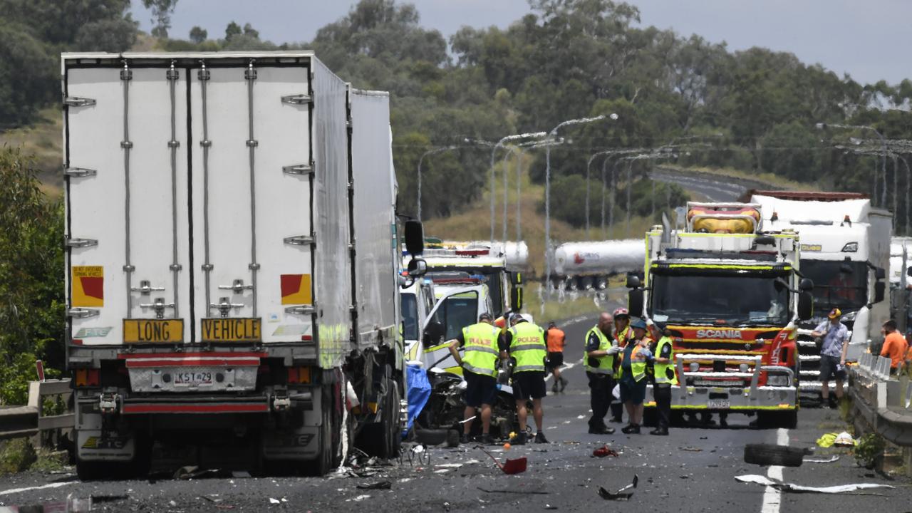 Emergency services at the scene of a serious crash involving a truck and car on the Warrego Highway near the Oakey Creek bridge. Photo: Nev Madsen.