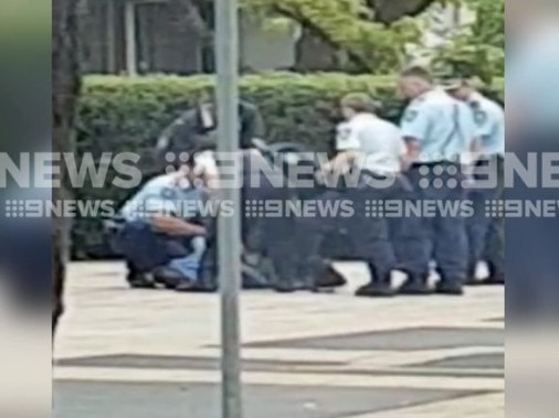 Footage shows police surrounding the man after he was Tasered. Picture: 9 News