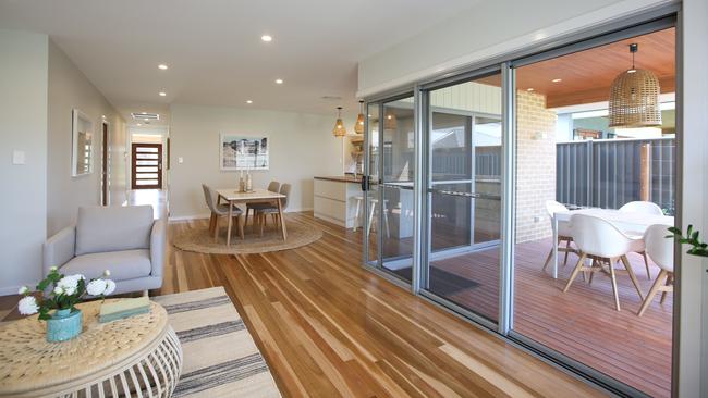 The atrium-style alfresco area connects the kitchen, meals, and family area.