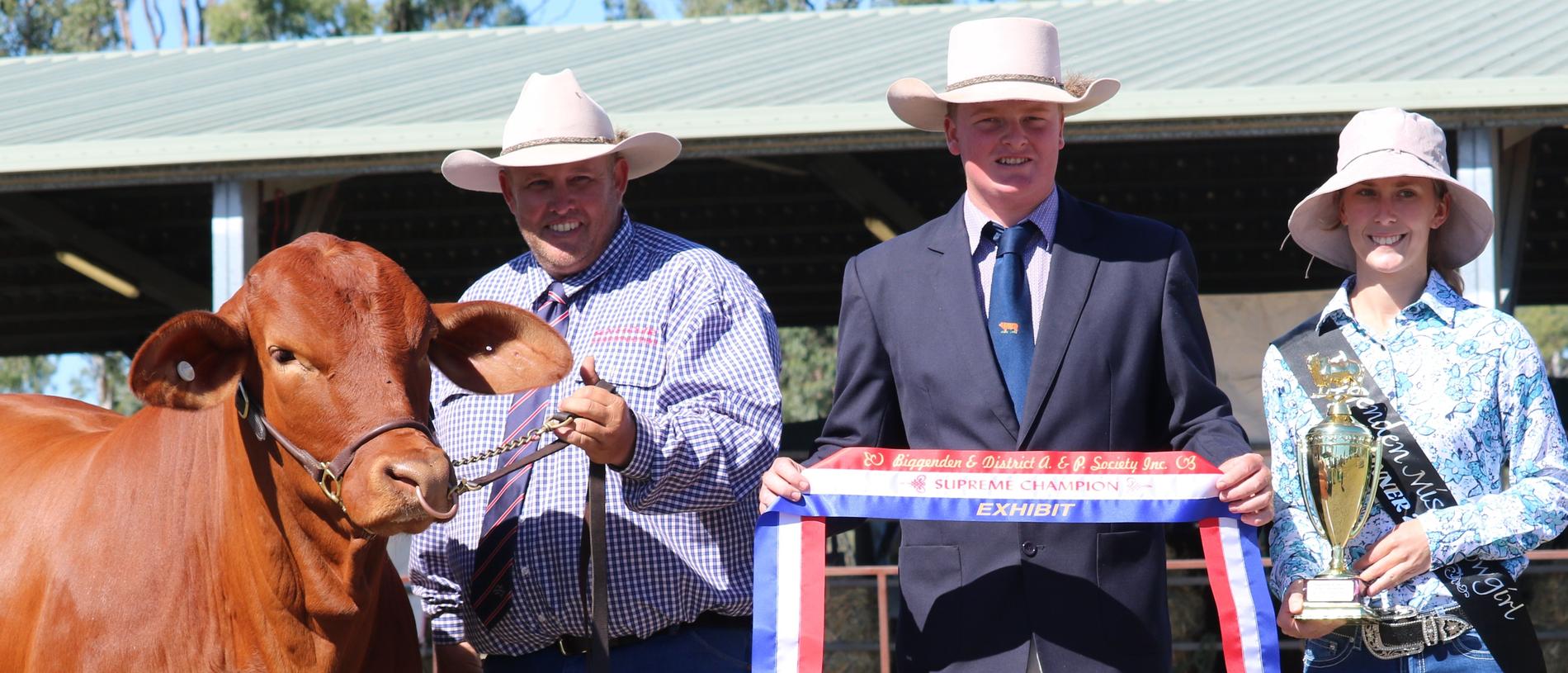 Rob Orphant of Seymour Droughtmasters with the supreme exhibit of the Biggenden Show, Seymour Sarah, judge Corey Evans and Miss Showgirl, 2018 Emily Bust.