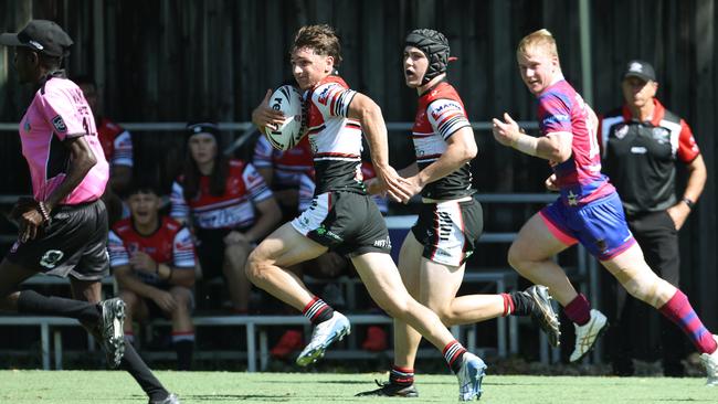 Riley Carbone makes a break down the sideline in the Aaron Payne Cup schoolboy rugby league match between St Augustine's College and Kirwan State High School, held at West Barlow Park, Cairns. Picture: Brendan Radke