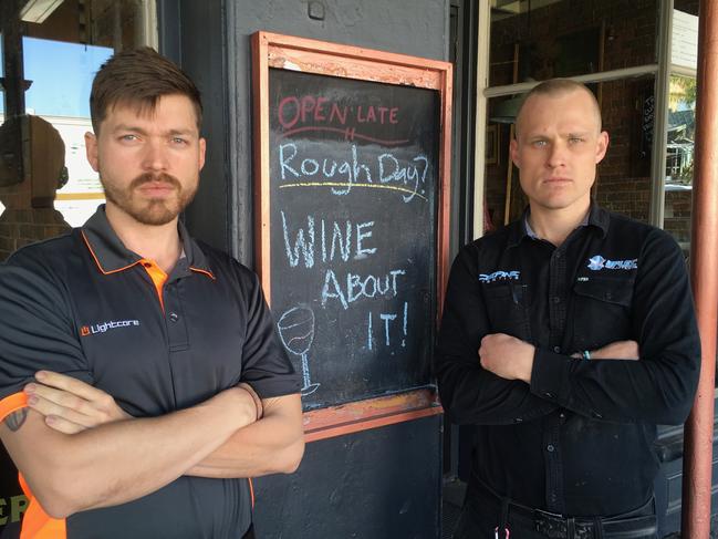 Neue director Dean Brosnan and electrician Lyle Rodgers outside Enzo and Son's in Caxton St. They allege they are owed $13,000 Picture: Darren Cartwright