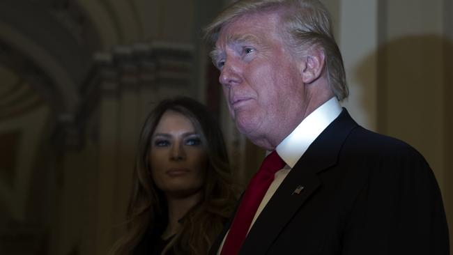 President-elect Donald Trump, accompanied by his wife Melania, at Capitol Hill in Washington yesterday.