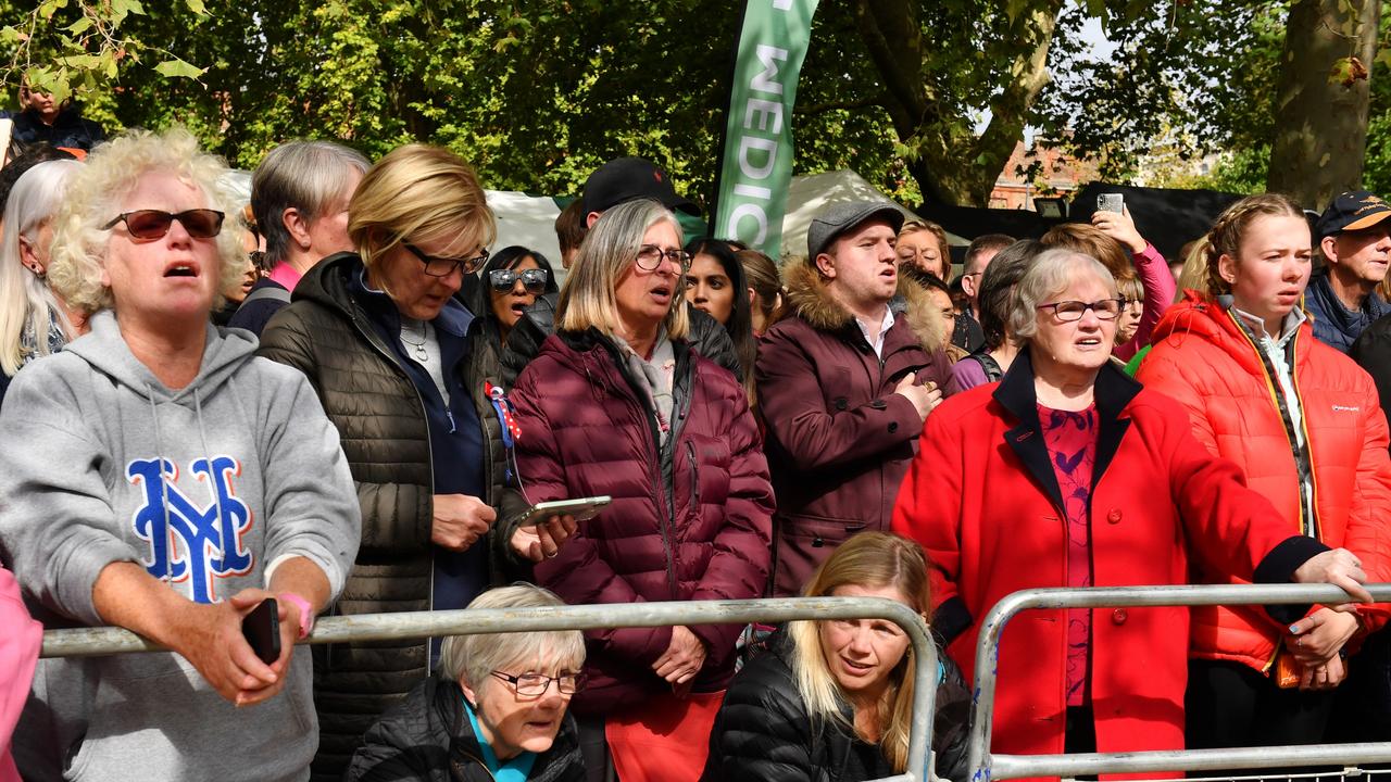 Mourners sing the National Anthem during the State Funeral of Queen Elizabeth II at Wellington Arch.