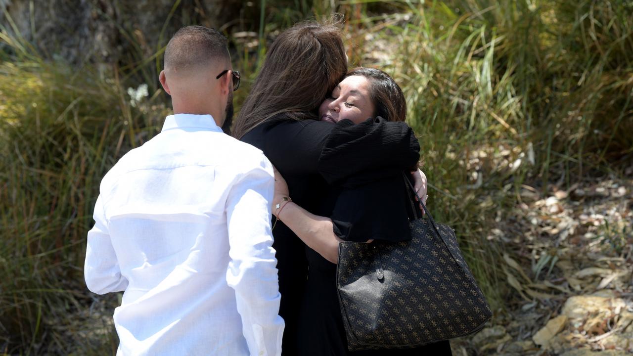 Loved ones held onto each other for support outside the memorial.Picture: NCA NewsWire / Sharon Smith