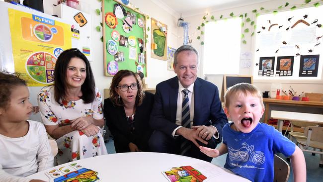 Lucas, 4 (right) reacts as he sits with Labor Candidate for Dickson Ali France (left), Shadow Minister for Early Childhood Education Amanda Rishworth (centre) and Leader of the Opposition Bill Shorten at the Goodstart Early Learning Centre at Albany Creek in Brisbane, Wednesday, October 3, 2018. Mr Shorten used the visit to discuss Prime Minister Scott Morrison's $440 million cut to preschool funding. (AAP Image/Dave Hunt) NO ARCHIVING