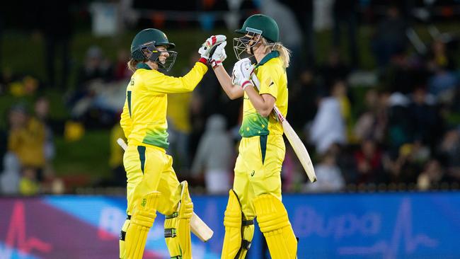 Rachel Haynes of Australia and captain Meg Lanning celebrate after winning the first match of the Women's Twenty20 (T20) Series between Australia and New Zealand