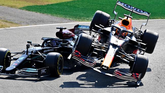 Max Verstappen of Red Bull Racing RB16B Honda and Lewis Hamilton