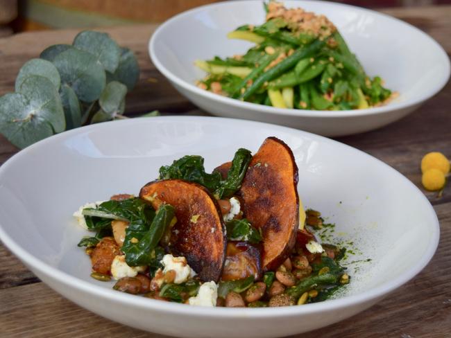 The Unicorn Hotel’s pumpkin salad with pickled beans, green olive and ricotta; and the bean and hazelnut salad. Picture: Jenifer Jagielski