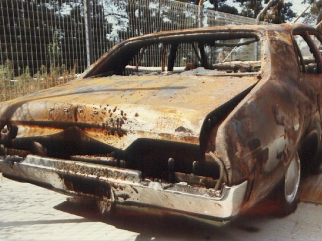 Never before seen crime scene photos pertaining to the murder of racehorse trainer George Brown in 1984. The burnt out Ford Falcon that Brown was found inside of pictured here at the police station during the investigation.