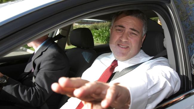 Joe Hockey being driven in a luxury taxpayer-funded car.