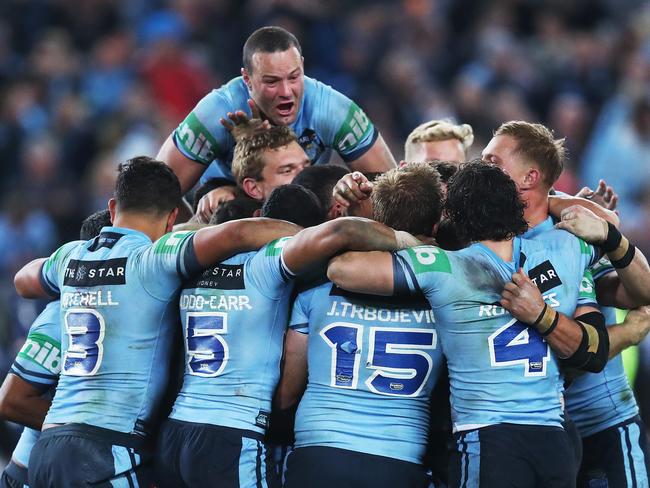 Players celebrate after the NSW Blues defeated Queensland Maroons in Game 2 of State of Series at ANZ Stadium, Sydney. Picture. Phil Hillyard