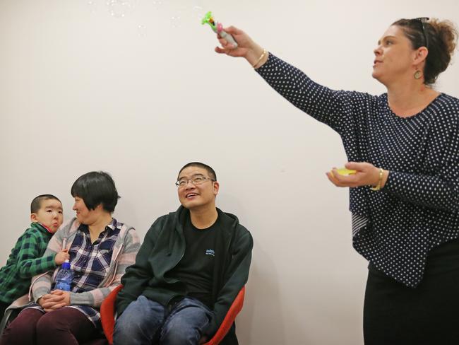 Charles, watched by parents Lena and James, appears not too sure by the appearance of bubbles. Picture: Toby Zerna