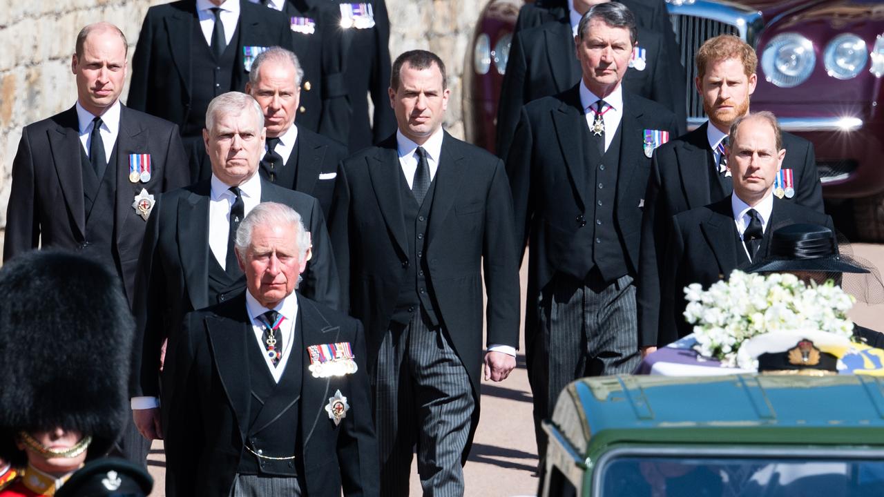 Peter Phillips, the eldest child of Princess Anne, was deliberately placed between the feuding brothers. Picture: AFP.