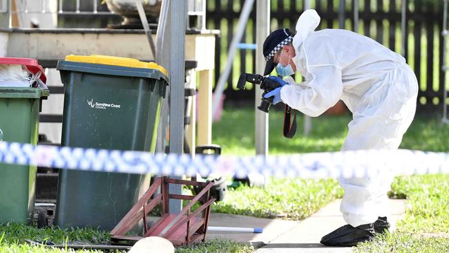 Police forensics officers at the scene. Picture: Patrick Woods.