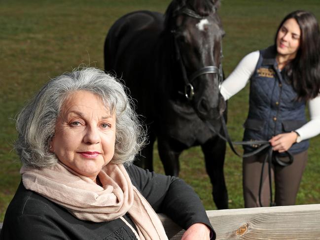 Maggie Dawkins with daughter Alice and horse Grace at her property.