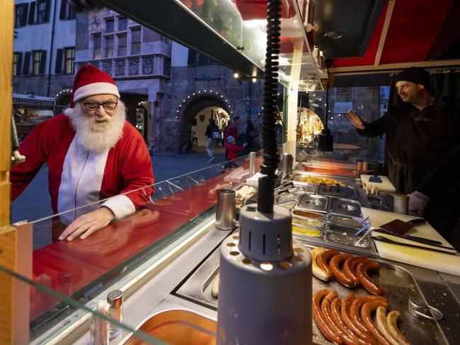 A man dressed as Santa is seen at the annual Christmas market during the first day of a nationwide lockdown for people not yet vaccinated against Covid. Picture: Getty Images