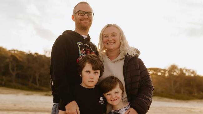 Tim and Megan Jones with their two sons aged 8 and 10 in Lorne. Tim was diagnosed with early onset dementia. Picture: Supplied