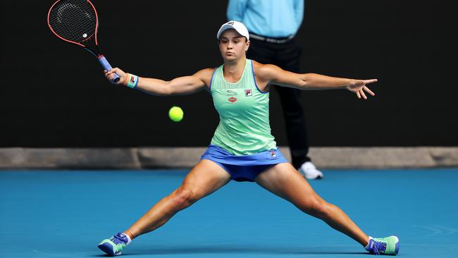 Australia’s world No 1 Ash Barty stretches out in her straight-sets third-round win over Kazakhstan’s Elena Rybakina at MelbournePark on Friday. Picture: Mark Stewart