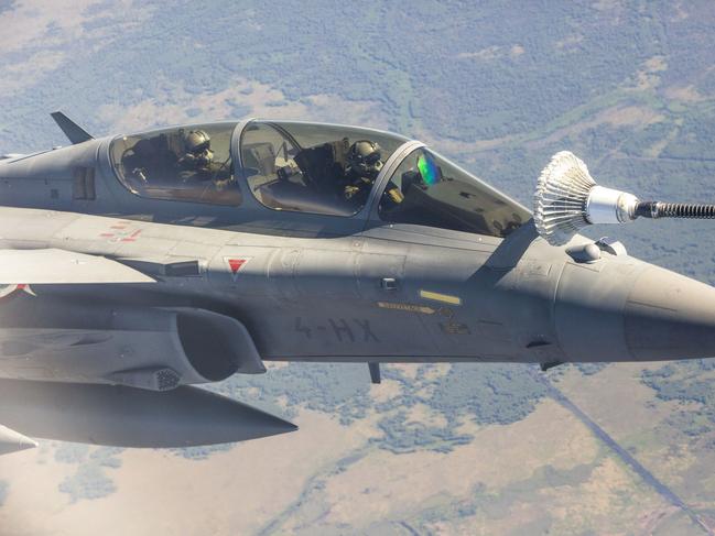 A French Rafale jet refuels mid-air about 100km south of Darwin. Picture: Floss Adams.