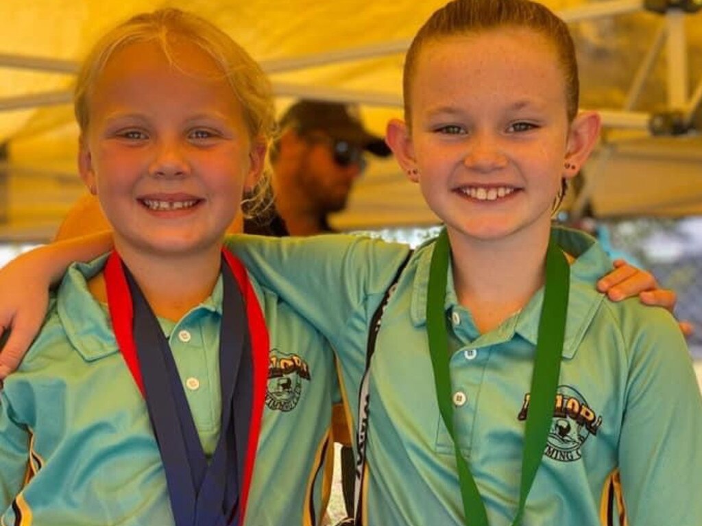 Under-8s Ella Hutchison and Ruby Patterson showing off their medals after another successful meet.