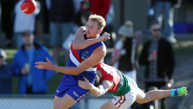 Mornington’s Jackson Calder fires off a handball. Picture: David Crosling