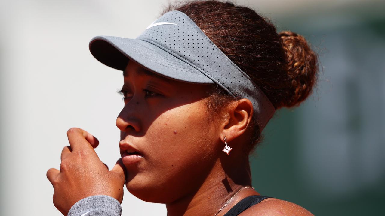 PARIS, FRANCE - MAY 30: Naomi Osaka of Japan looks on in her First Round match against Patricia Maria Tig of Romania during Day One of the 2021 French Open at Roland Garros on May 30, 2021 in Paris, France. (Photo by Julian Finney/Getty Images)