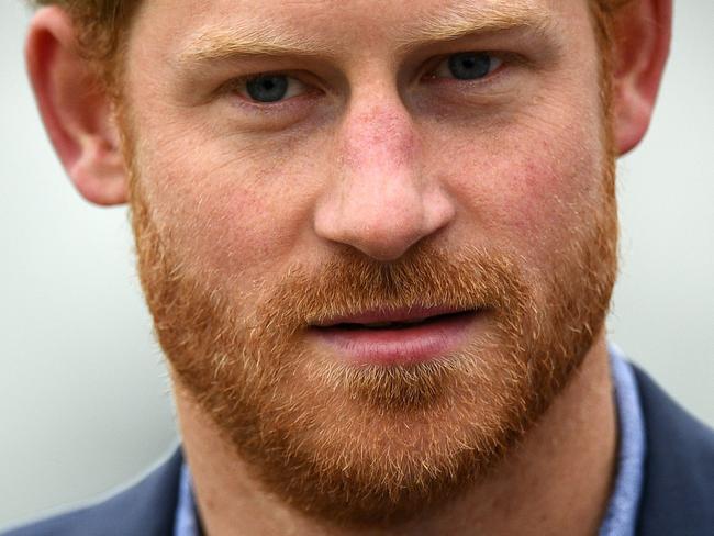 (FILES) This file photo taken on October 07, 2016 shows Britain's Prince Harry arriving at Lord's cricket ground in London on October 7, 2016.  Britain's Prince Harry has spoken out about the heartbreaking images of him following his mother's coffin during her 1997 funeral, telling Newsweek that no "child should be asked to do that." The 32-year-old prince has recently opened up about the mental scars left by his mother's death in a car crash almost 20 years ago, and told the US weekly magazine of the pain of having to walk behind her coffin in front of thousands of onlookers.  / AFP PHOTO / JUSTIN TALLIS