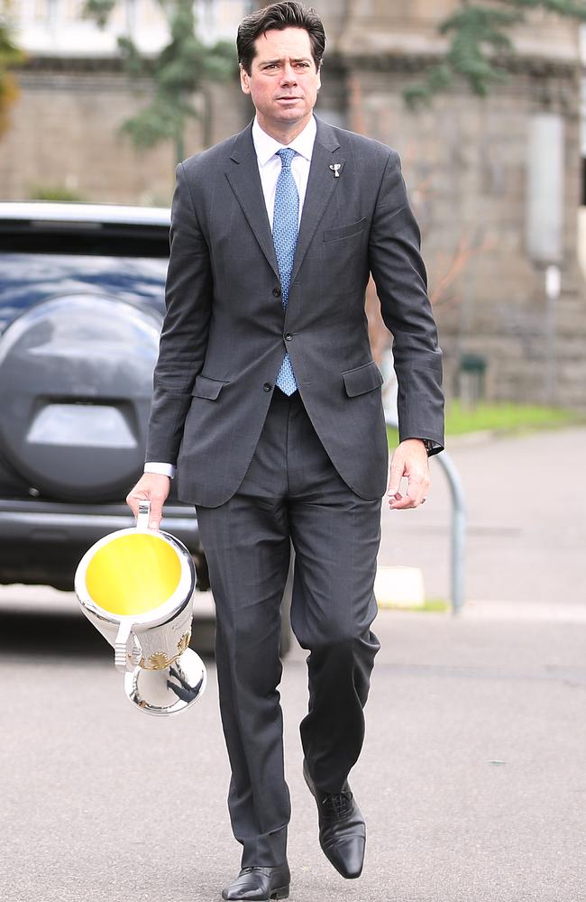 Gillon McLachlan carries the premiership cup to the AFL finals launch. Picture: Wayne Ludbey