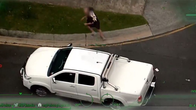 Sen runs from the vehicle he was driving as police close in. Photo: Queensland Police