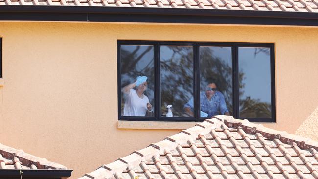 Kefu's family, friends and neighbours doing a working bee to prepare the property for his return following a home invasion earlier this week. Picture: Tara Croser